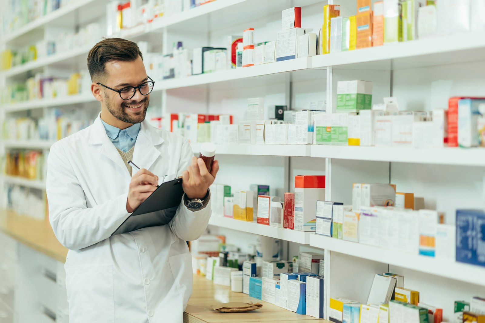 Portrait of a handsome pharmacist working in a pharmacy